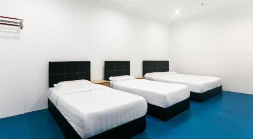 Spot On 89726 Capsule Inn Кота-Кинабалу Экстерьер фото